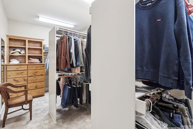 walk in closet featuring tile patterned flooring