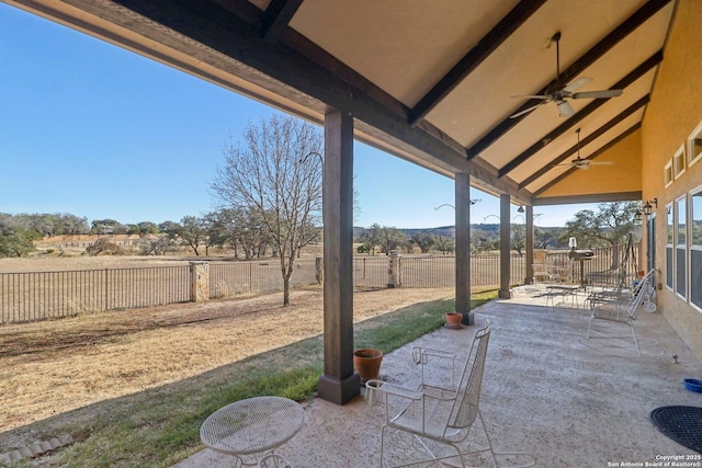 view of patio / terrace with a rural view and ceiling fan