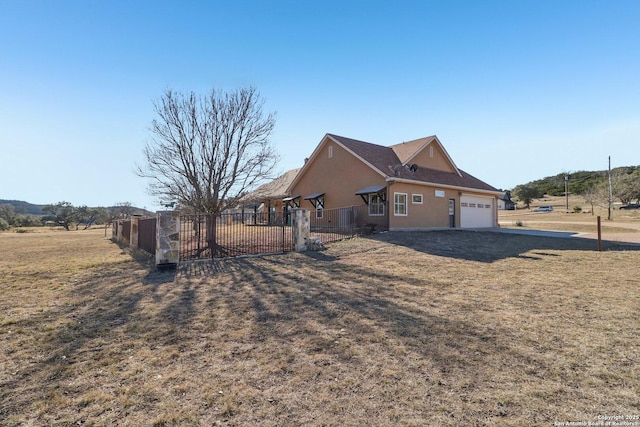 view of side of property featuring a garage