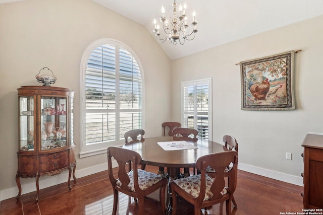 dining space featuring an inviting chandelier, dark hardwood / wood-style floors, and vaulted ceiling