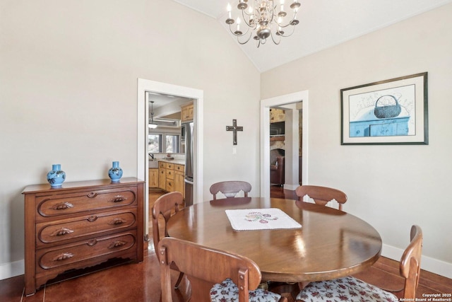 dining space with lofted ceiling and a notable chandelier