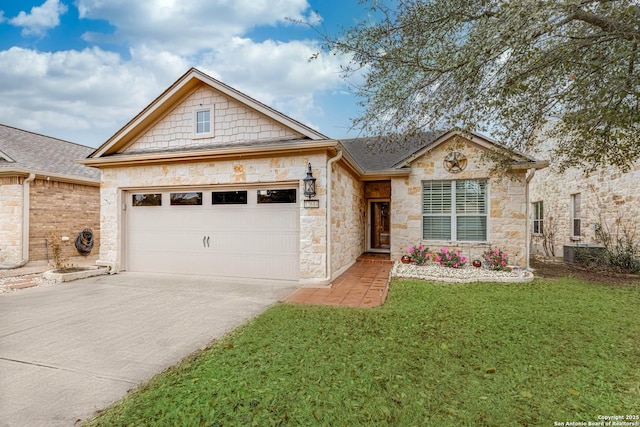 view of front of property with a garage and a front lawn