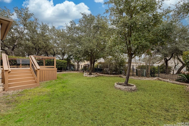 view of yard featuring a wooden deck