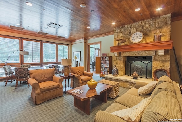 living room with ornamental molding, a stone fireplace, carpet floors, and wood ceiling