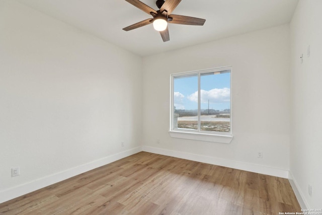 spare room with ceiling fan and light hardwood / wood-style flooring