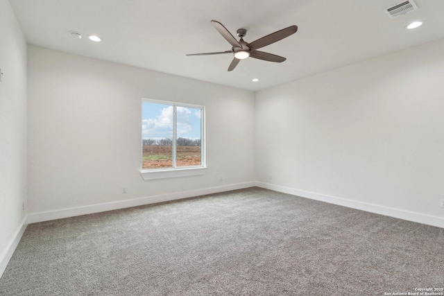 unfurnished room with carpet flooring and ceiling fan