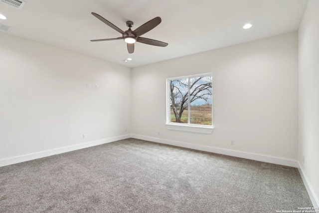 spare room with ceiling fan and carpet flooring