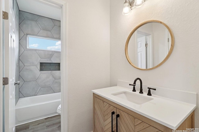 bathroom featuring hardwood / wood-style flooring, vanity, and toilet