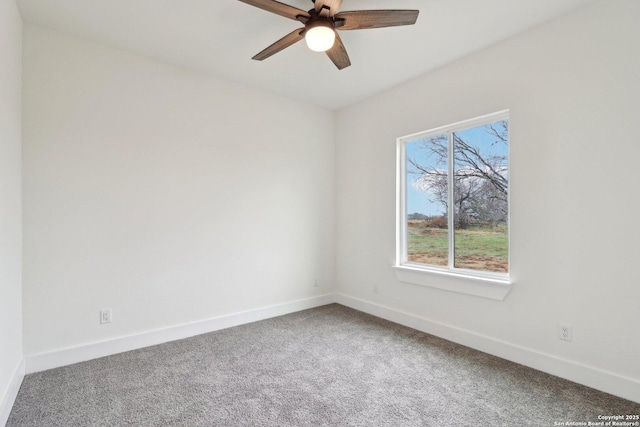 carpeted empty room with ceiling fan