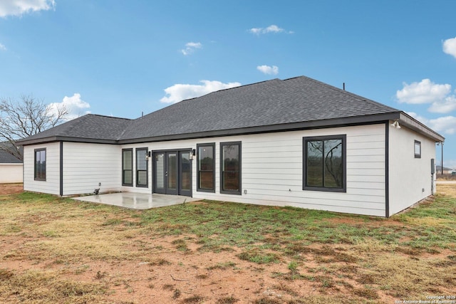 rear view of property with a patio area and a lawn