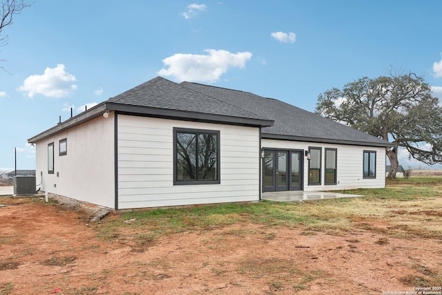 back of property featuring a patio, a yard, and cooling unit