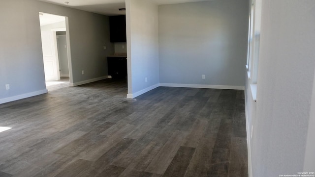 unfurnished room featuring dark hardwood / wood-style flooring