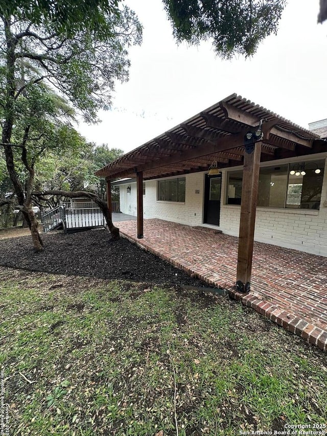 view of yard with a pergola and a patio