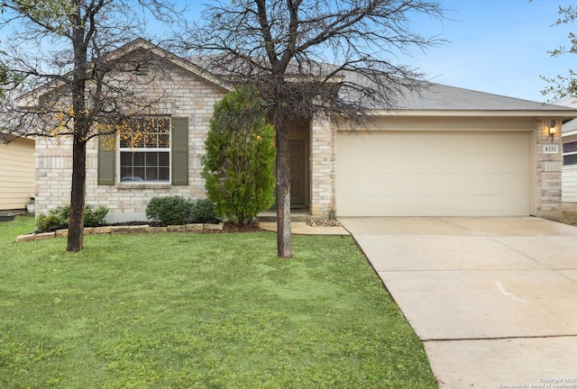 ranch-style home with a garage and a front yard