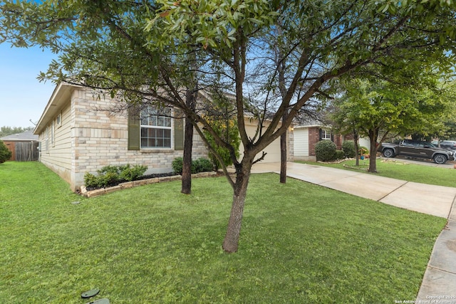 view of front of home with a garage and a front lawn