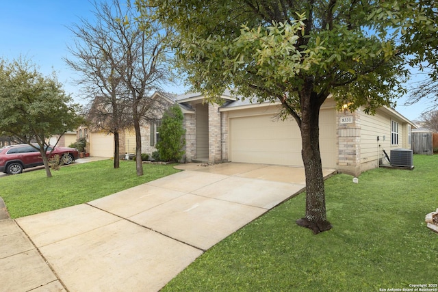 view of front of house featuring a garage, central AC unit, and a front lawn