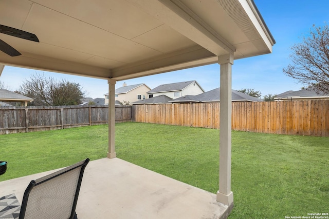 view of yard with a patio and ceiling fan