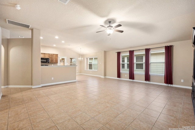 unfurnished living room with lofted ceiling, ceiling fan with notable chandelier, a textured ceiling, and light tile patterned floors