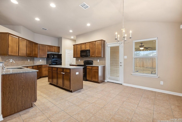 kitchen with a kitchen island, sink, hanging light fixtures, black appliances, and an inviting chandelier