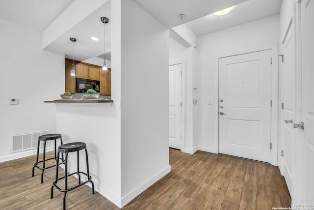 foyer entrance featuring hardwood / wood-style floors