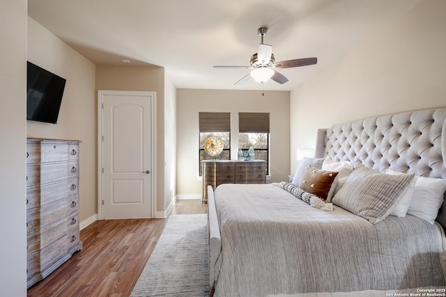 bedroom with hardwood / wood-style flooring and ceiling fan