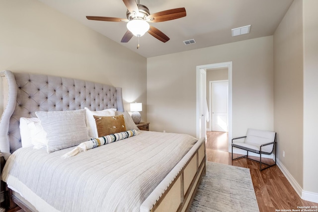 bedroom with hardwood / wood-style floors and ceiling fan