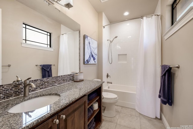 full bathroom with shower / tub combo with curtain, decorative backsplash, tile patterned flooring, vanity, and toilet