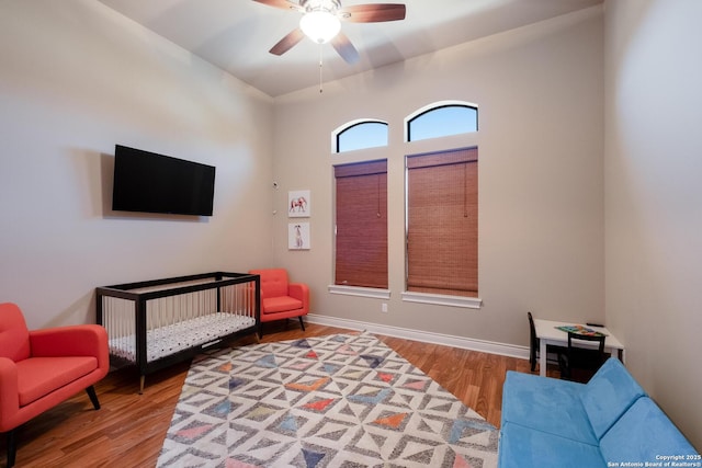 interior space featuring wood-type flooring and ceiling fan