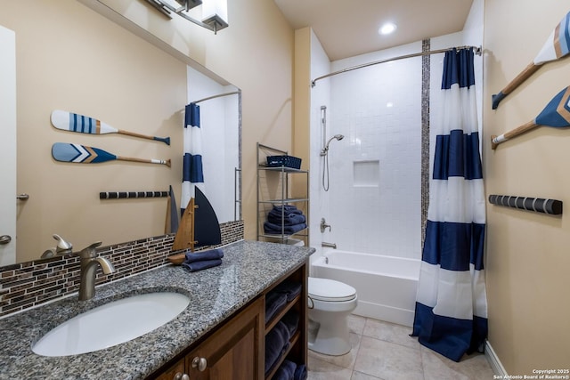 full bathroom featuring tasteful backsplash, shower / bath combination with curtain, tile patterned flooring, vanity, and toilet