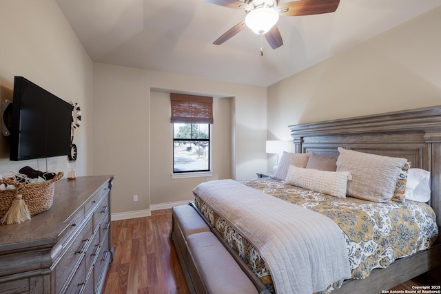 bedroom with ceiling fan and dark hardwood / wood-style floors