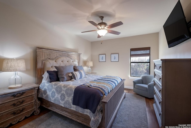 bedroom featuring ceiling fan and dark hardwood / wood-style flooring