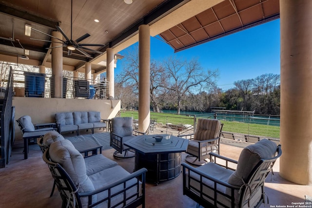 view of patio with outdoor lounge area and ceiling fan