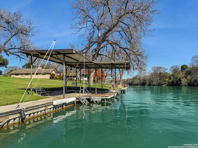 view of dock featuring a water view and a yard