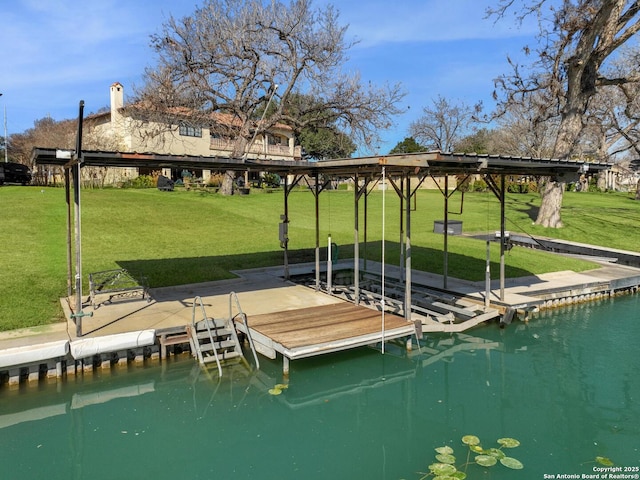 view of dock with a water view and a lawn