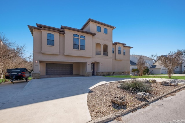 mediterranean / spanish-style home with a garage