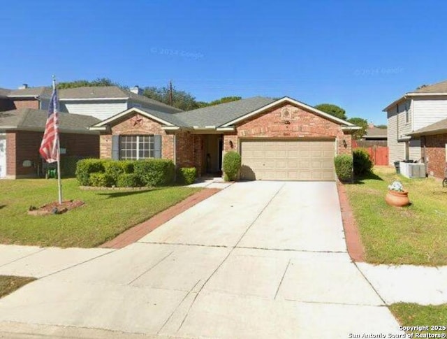 single story home with a garage and a front lawn