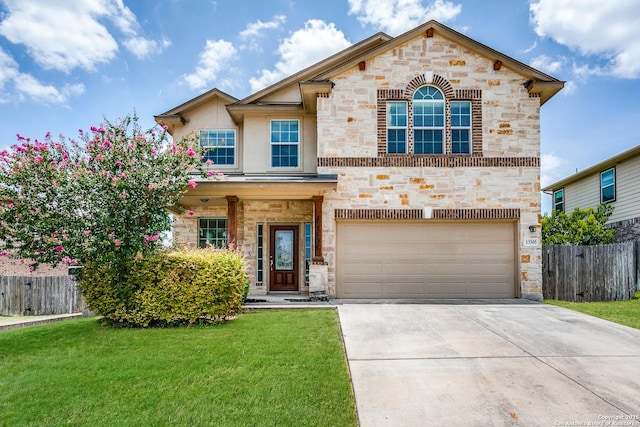 view of front of house featuring a garage and a front lawn