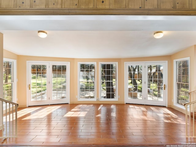 entryway with hardwood / wood-style flooring