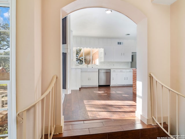 hall with sink and hardwood / wood-style floors