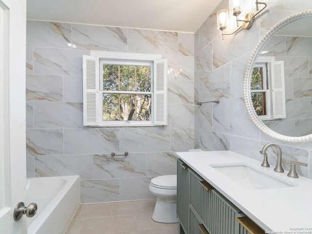 bathroom with vanity, tile patterned flooring, tile walls, and toilet