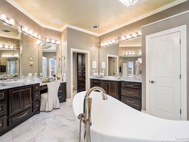 bathroom featuring ornamental molding and vanity