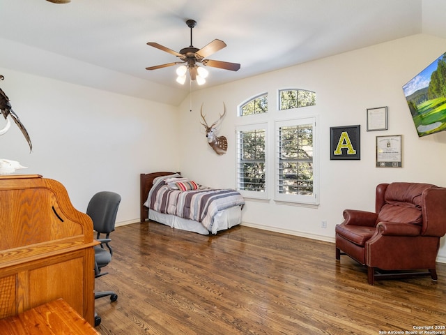 bedroom with lofted ceiling, dark hardwood / wood-style flooring, and ceiling fan