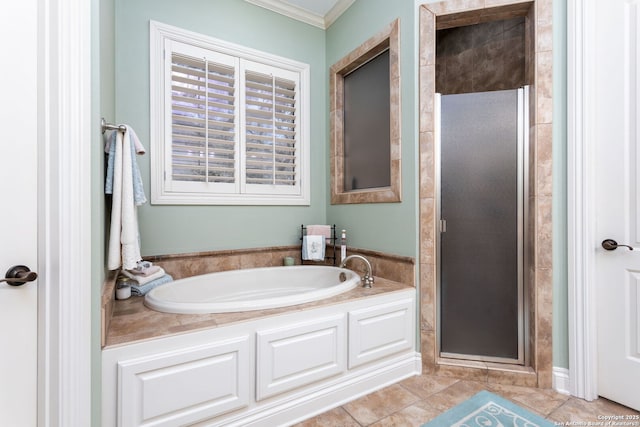 bathroom featuring tile patterned flooring, crown molding, and plus walk in shower