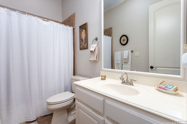 bathroom with tile patterned floors, vanity, and toilet