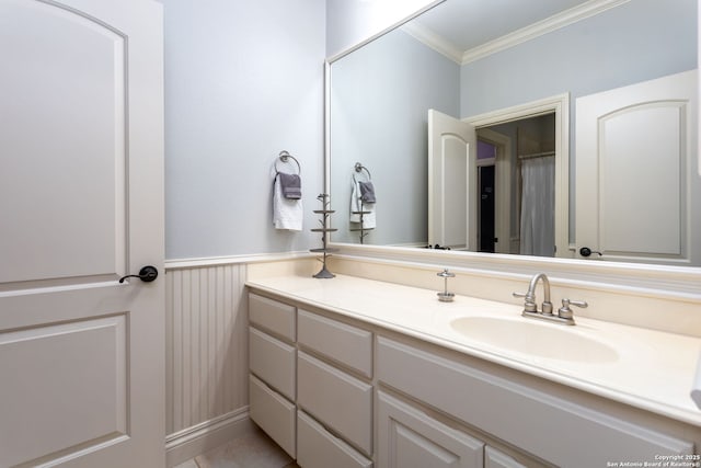 bathroom with vanity and ornamental molding