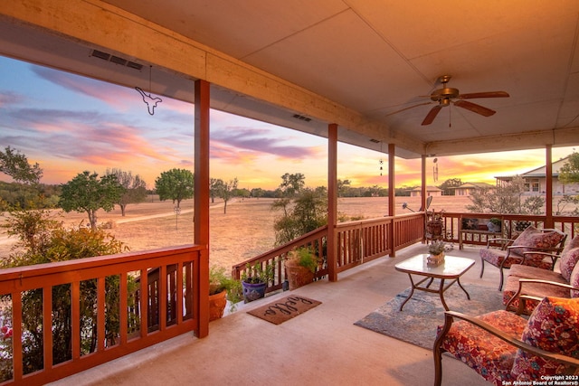 patio terrace at dusk with ceiling fan