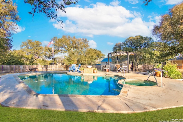 view of swimming pool with a pergola, a patio area, and an in ground hot tub