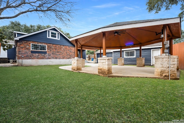 view of yard with a gazebo, a patio, and ceiling fan