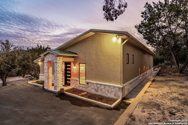 view of property exterior at dusk