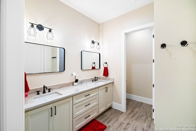 bathroom featuring wood-type flooring and vanity